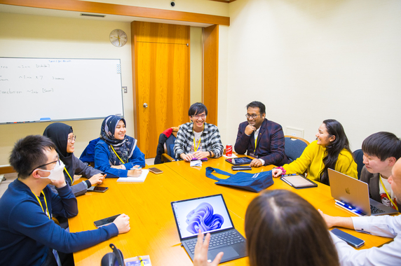 Participants working in teams on assignments