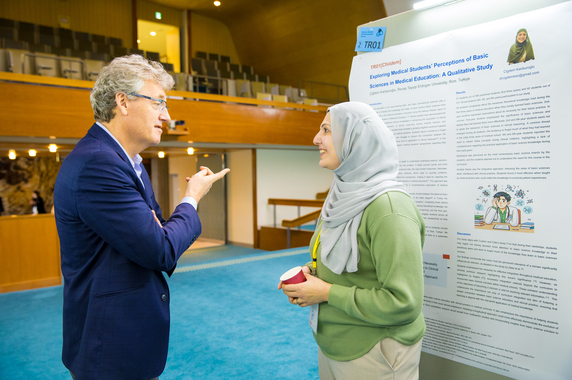 Dr. MacMillan at a Poster Session